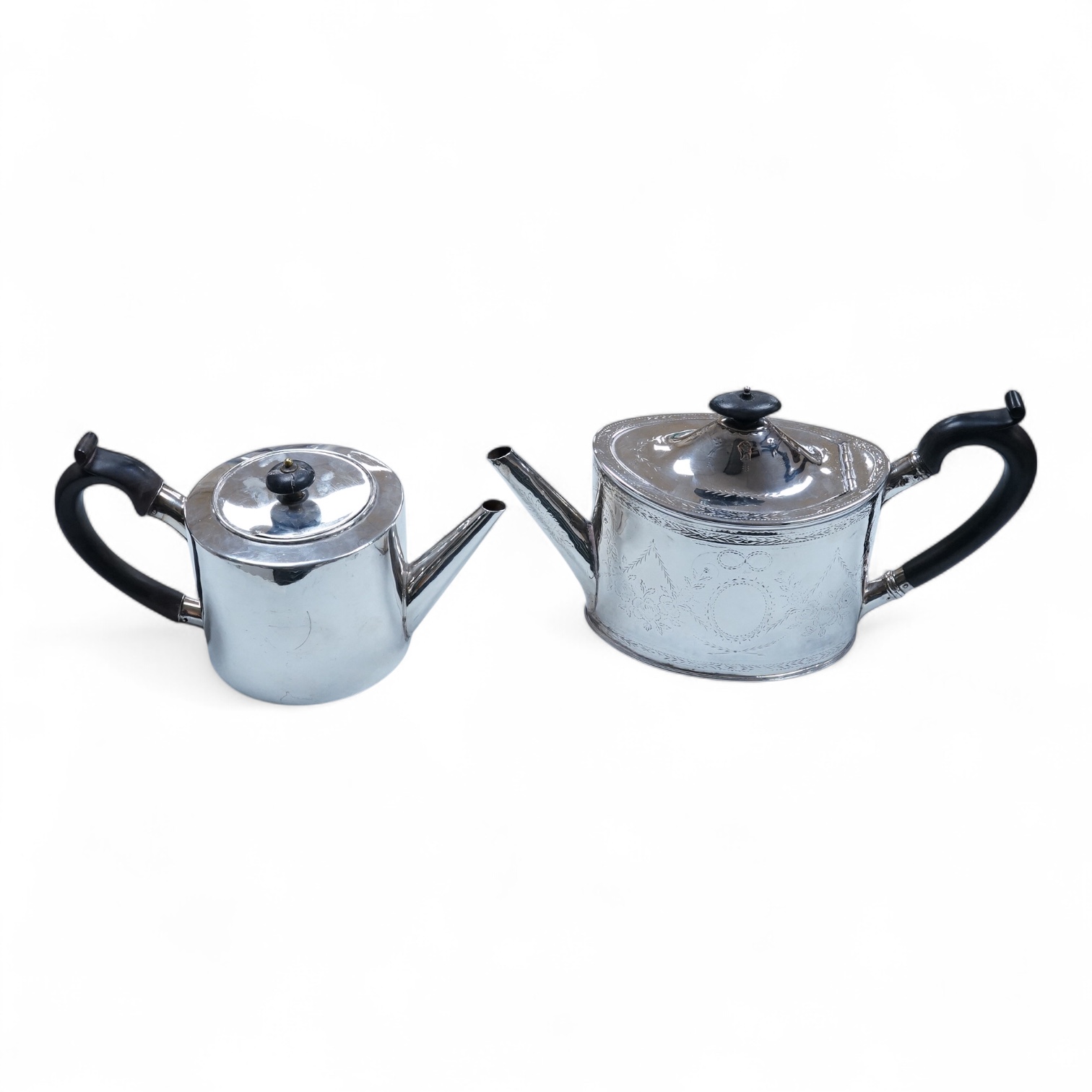 A George III engraved silver oval teapot, makers mark RD?, London, 1794, together with one other Georgian silver teapot with associated silver cover, gross weight 26.8oz.